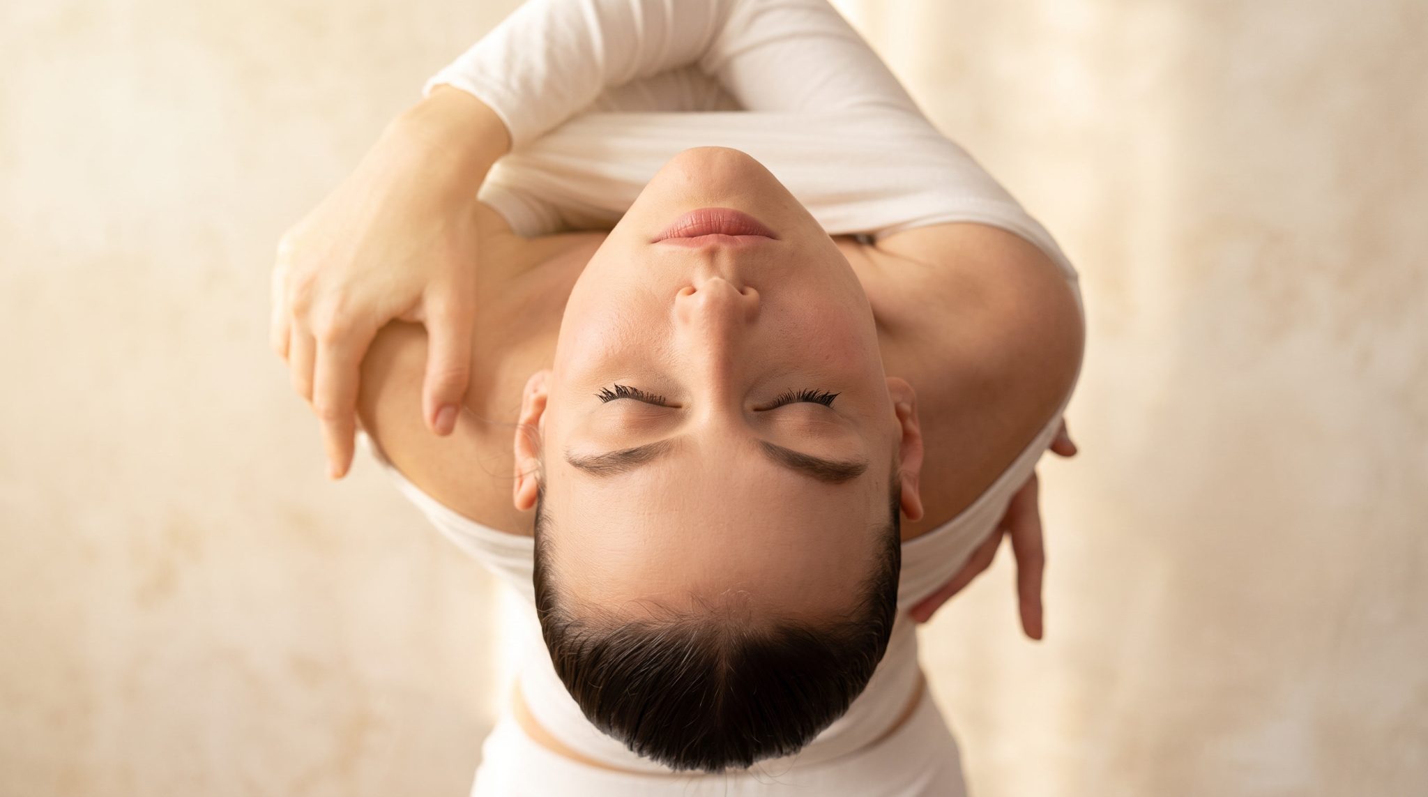Woman posing gracefully with closed eyes.
